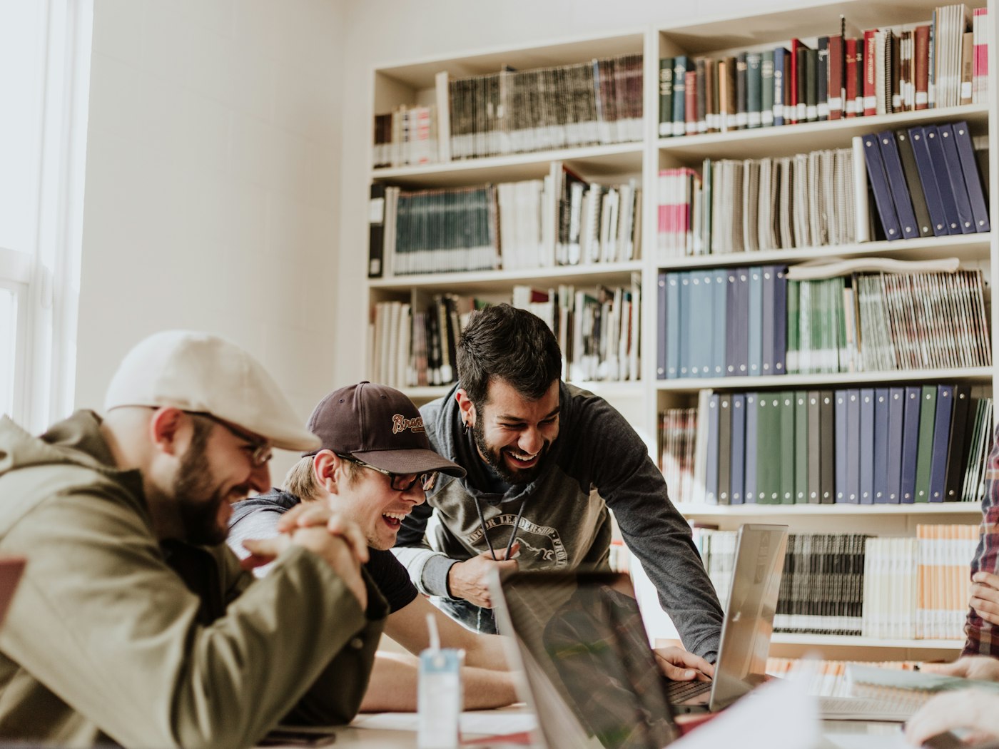 A group of students studying together around a table